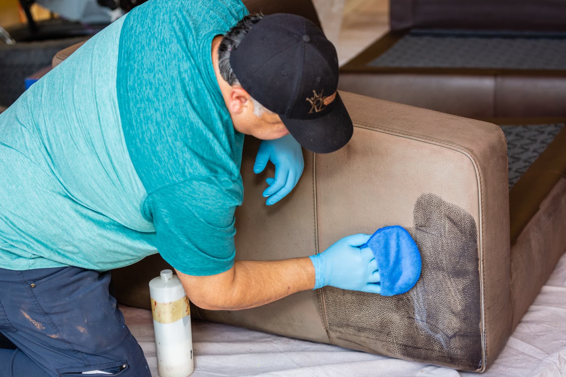 Michael working on leather furniture