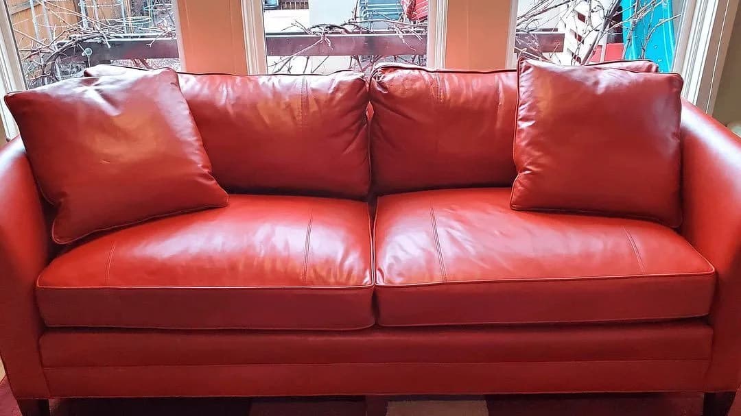 Red leather sofa in a bright room