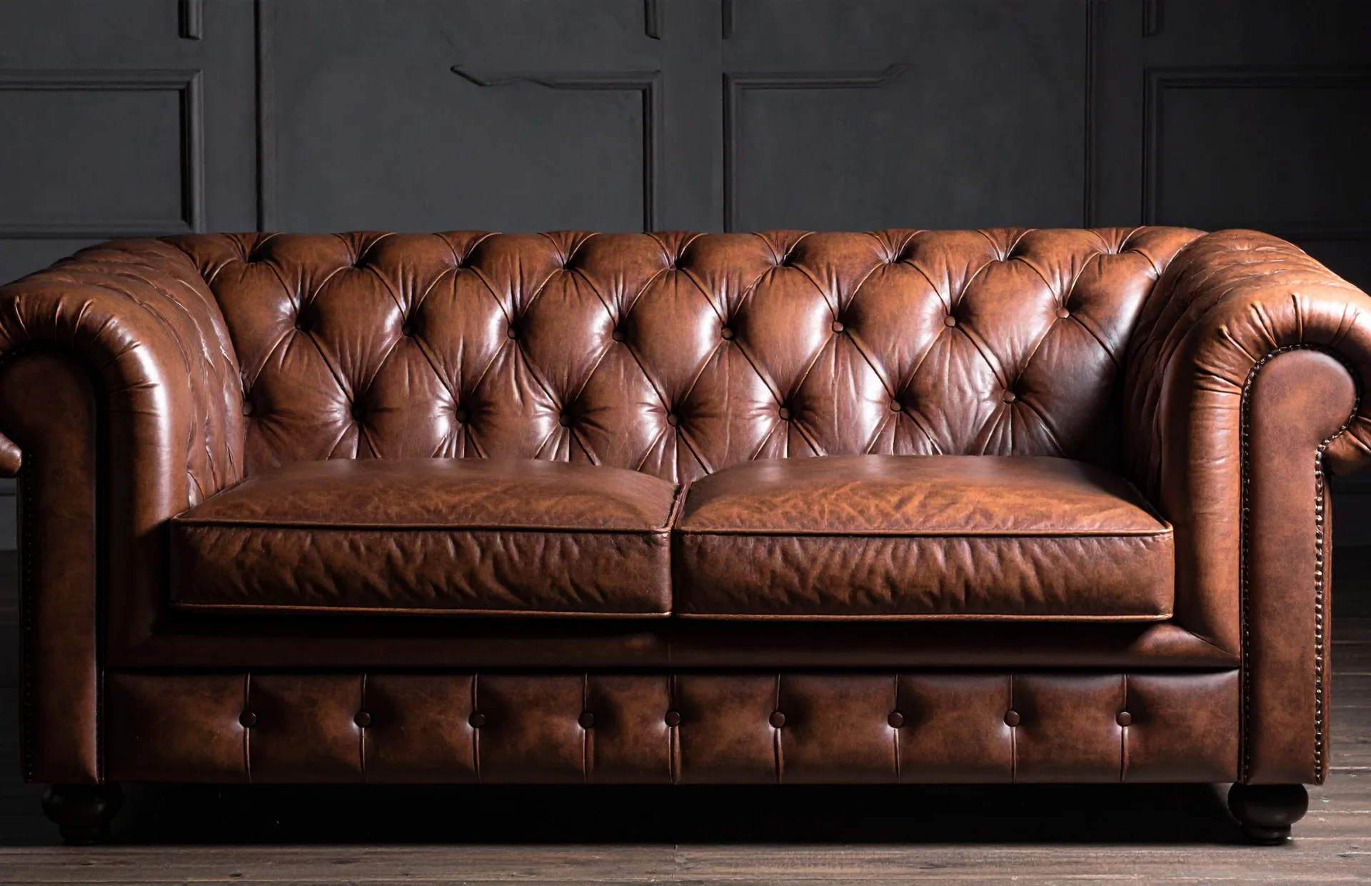 Brown tufted leather sofa