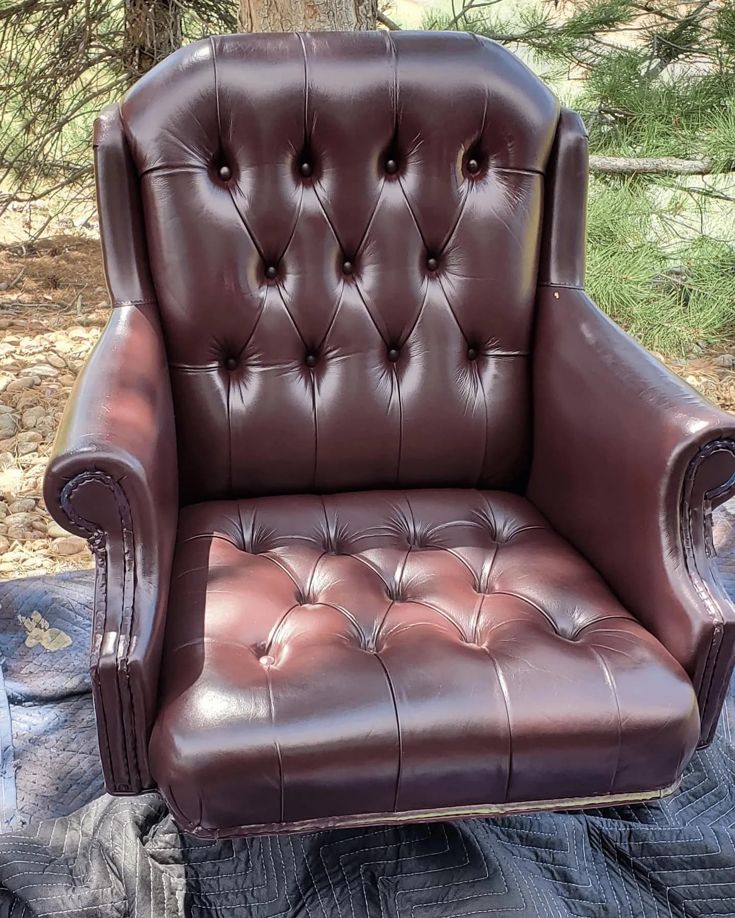 Brown tufted leather armchair